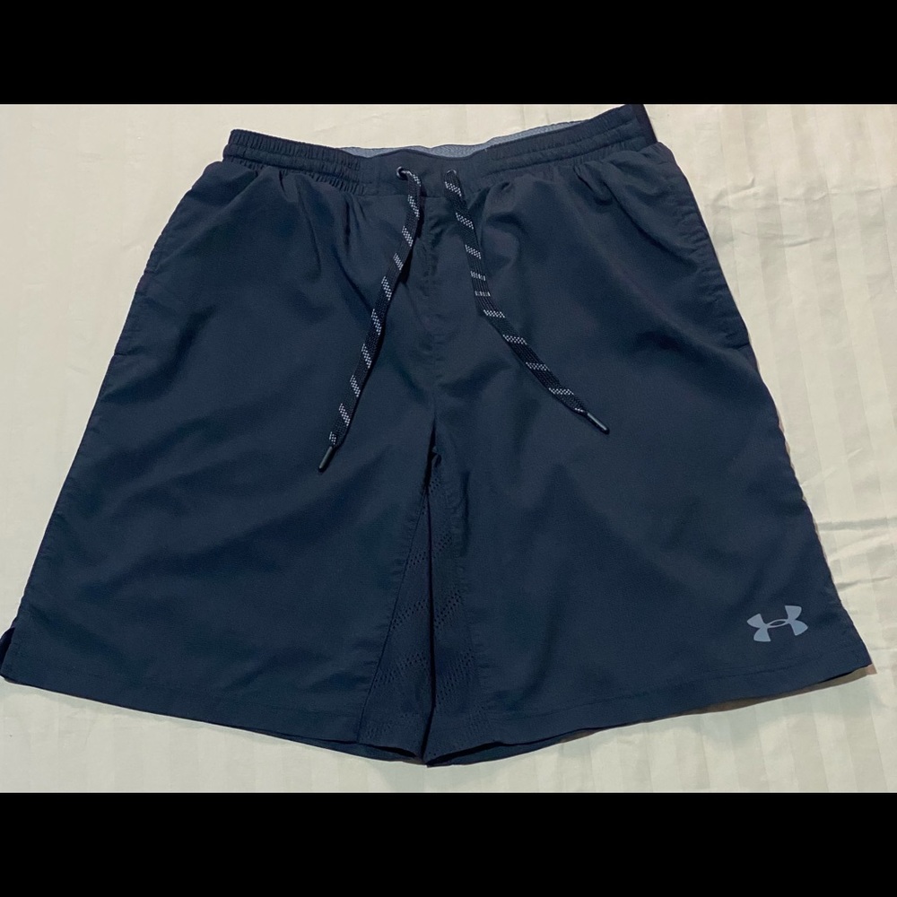 Like new black under armor shorts with venting mesh in the back.